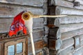 Doll in MeteÃâ i mumming mask and costume of stork, wearing red kerchief.